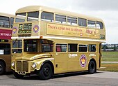 One of London's special Golden Jubilee AEC Routemaster buseses, adorned in special gold livery to mark the Queen's Golden Jubilee