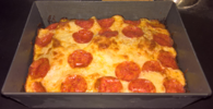 Detroit-style pizza in a traditional pan