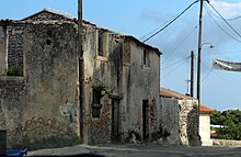 An image of an Alley in Exo Chora with buildings a little run down