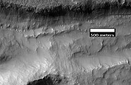 Close-up of gullies in trough, as seen by HiRISE under the HiWish program. These are some of the smaller gullies visible on Mars. Location is Phaethontis quadrangle.