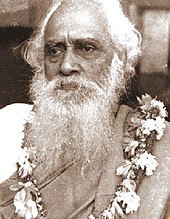 Portrait of an old man sitting in a chair.