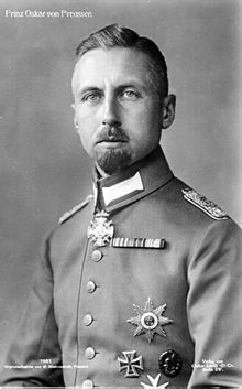 Prince Oskar is pale-eyed, has a short goatee and wears uniform and medals