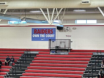 Sign reading "Raiders own the court"