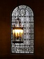 The stained glass window in the staircase.