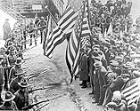 Massachusetts militiamen with fixed bayonets surround a group of strikers