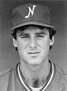 A black and white photograph of a baseball player