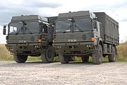 On Salisbury Plain training area, two British Army HX60 4×4 trucks in General Service configuration; note the registration numbers