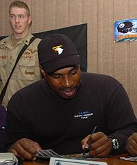 Byars in Tikrit, Iraq, signing autographs during a February 2006 troop visit.