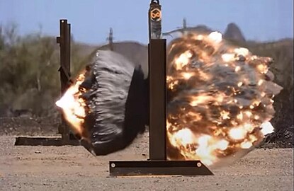 M1147 blasting through a reinforced concrete wall