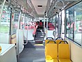 Image 13Interior of a wheelchair-accessible transit bus, with bucket seats and smart-card readers at the exit. (from Transit bus)