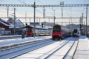 Red trains in snow
