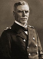 Naval officer in dress uniform looking at the camera