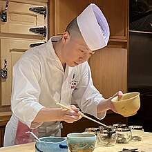 Chef Masaki Saito preparing a course at Sushi Masaki Saito.