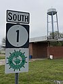 Benoit water tower in background, Mississippi Highway 1 sign in foreground.