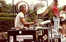 Dom Um Romão hosting an outdoor concert in Central Park, around 1980