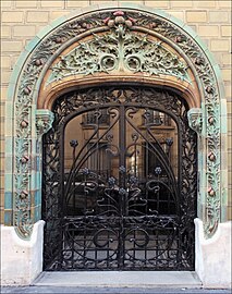 French Art Nouveau - Entrance decorated with glazed tiles of the Les Chardons Building (Rue Eugène-Manuel no. 2), Paris, 1903, by Charles Klein[68]