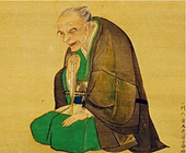 a kneeling Japanese man