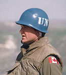 Canadian peacekeeper wearing the distinctive UN blue helmet