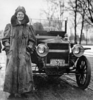 Alice Huyler Ramsey, standing beside her automobile, c. 1908