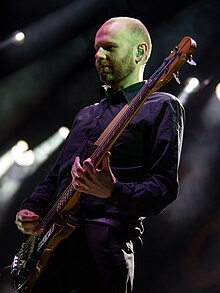 Hardy performing with Franz Ferdinand in 2019