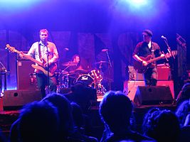 Doves performing live in 2009. From left to right: Jimi Goodwin, Andy Williams, and Jez Williams.