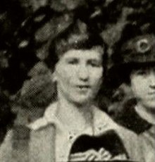 Young woman with hair tied back