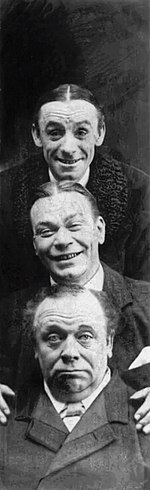 Photo of three men, with one head stacked above the other, two smiling and the bottom one gruff,