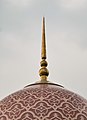 The patterned dome of pink and white granite tiles is a distinctive feature.