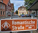 Bilingual Romantic Road sign in Röttingen, Germany