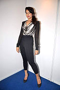 Indian actress Sameera Reddy wearing contrasting black and white top