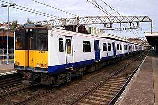 Image showing a Transport for London Rail liveried Class 315 calling at Forest Gate