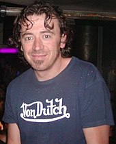 Benny Benassi looking to the camera and smiling.