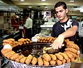 A Palestinian youth serving Falafel in Ramallah.