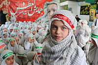 Iranian children wearing keffiyehs during a religious gathering in Iran