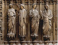 West portal Annunciation group at Reims Cathedral with smiling angel at left (13th century)
