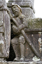 A sleeping soldier to the right of the tomb from which the resurrected Jesus has emerged