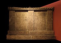 Stone sarcophagus of Princess Yongtai (side view, reproduction), Qianling Museum. Designed as a stone house with hip-and-gable roof, it is comparable to the sarcophagus of Li Jingxun, although much larger with a surface of 40 square meters.[12][13]