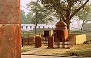 A woman worshipping at a Hindu temple nearby Platform No. 2