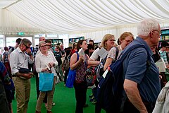 Attendees line up to meet authors at book signings, immediately after each session