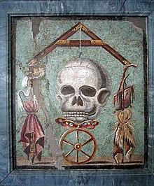 Symbolism of Fortuna's wheel divine justice and Skull mortality in a Pompeiian mosaic