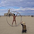 Image 41Naked participant at Burning Man 2016 posing as Leonardo da Vinci's Vitruvian Man (from Naturism)
