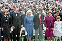 A group of spectators at a funeral