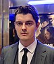 Head-and-shoulders colour photograph of Sam Riley in 2014