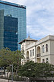 Levin House (1924) on Rothschild Boulevard flanked by modern glass tower