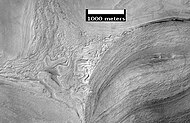 Apparent viscous flow features on the floor of Hellas, as seen by HiRISE.