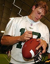 Man signing a football