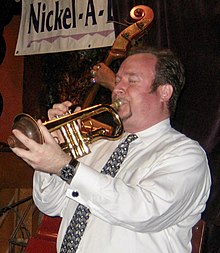 Jon-Erik Kellso playing the trumpet