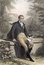 Gravure en couleur montrant Joseph Bonaparte assis sur un muret et tenant dans sa main gauche un livre ouvert.