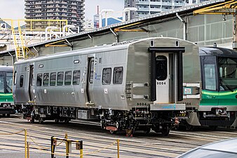 Car no. 9004 at Kawasaki Heavy Industries' Hyogo plant in 2017. The trains next to the M9 are Tokyo Metro 16000 series.