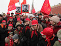 Party members lay down flowers at the tomb of Joseph Stalin